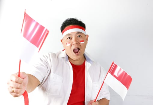 A man with indonesian flags on his head photo