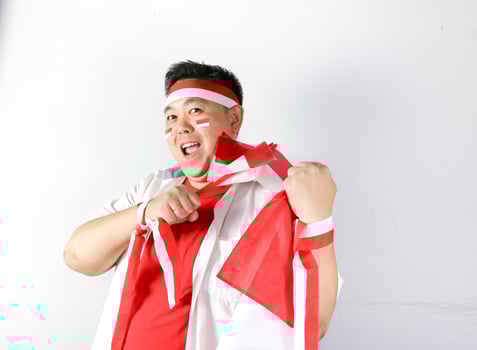 Asian man holding a flag and smiling photo