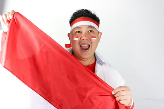 A man holding up a red flag photo