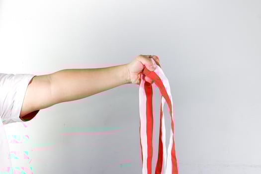 A man holding ribbon, soccer winning team photo