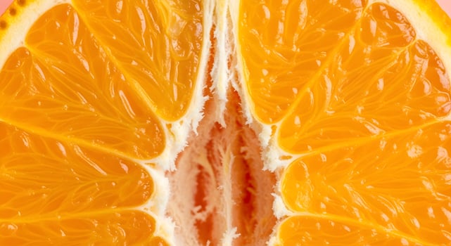Extreme close-up of orange flesh showing juicy pulp details, ultra detailed, crisp edges, noise free, natural lighting, pastel peach background, vibrant citrus macro image photo