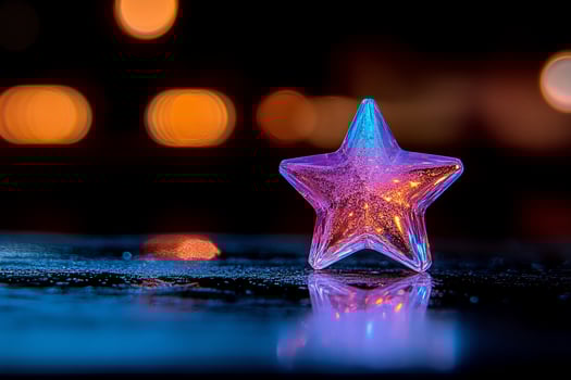 Illuminated star ornament on wet surface city lights photo