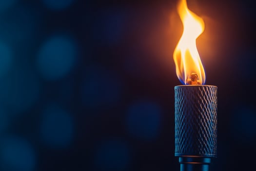 Nighttime torch flame dark bokeh background outdoor lighting photo