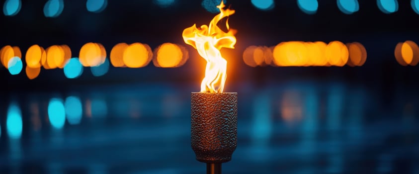Night flame torch burning bright city bokeh photo