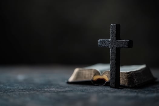 Cross and open Bible on a dark background surface photo