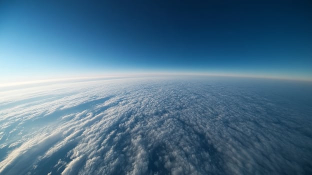 Expansive view of cloud cover above the earth with a blue sky at twilight photo