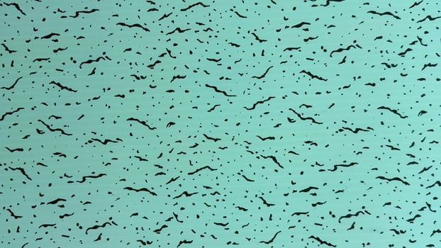 Water green surface displays a speckled texture of black spots and streaks in high resolution photo