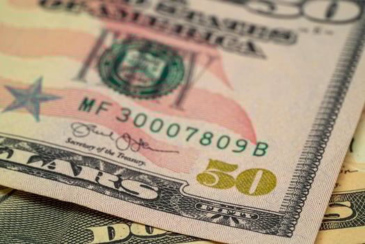 Fifty Dollar Bill With Close-Up Details of Currency Design photo