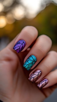Woman's hand, autumn park, colorful nails, manicure design, beauty blog photo