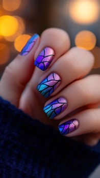 Woman's hand, stainedglass nails, bokeh background, holiday, manicure photo