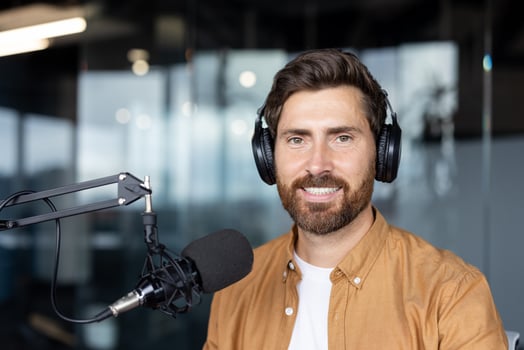 Man with headphones at a microphone photo
