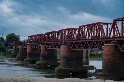 A old rail bridge on the river photo