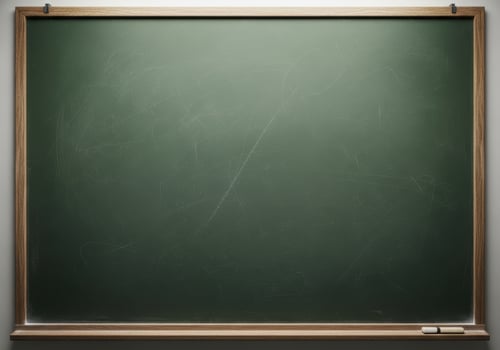 Empty green chalkboard with wooden frame and chalk piece photo