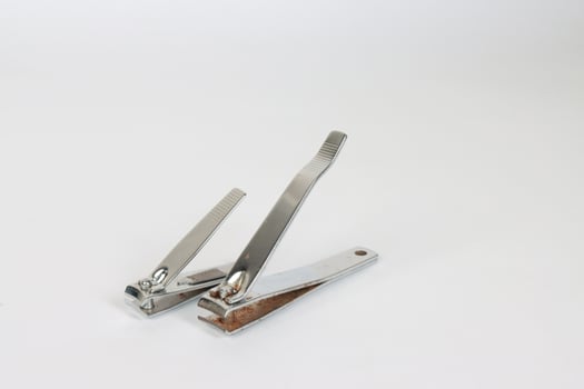 Two Old worn out Toe and Nail clippers on Isolated White Background photo