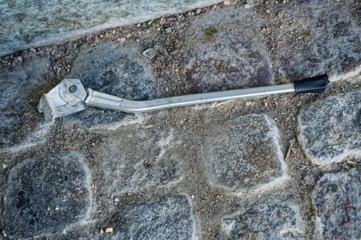 Metal Bicycle Kickstand on Cobblestone Pavement in Copenhagen CPH photo