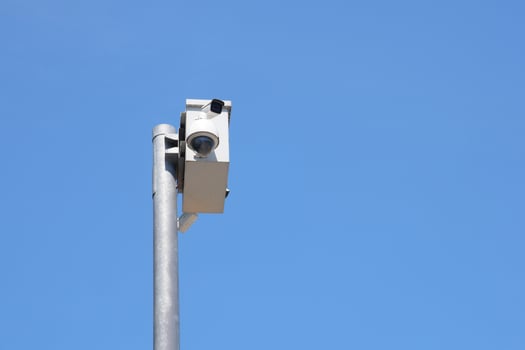 Surveillance camera monitoring traffic on a clear day photo