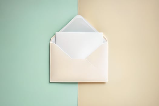 Open envelope with blank paper on a pastel background photo