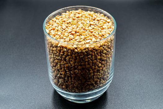 Org dry buckwheat grain consisting of raw natural product photo