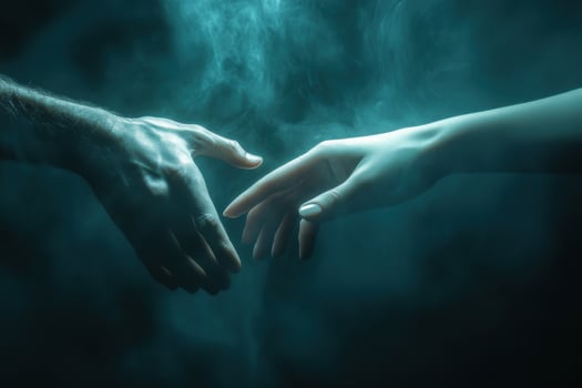 Two hands reaching out to each other in the dark photo