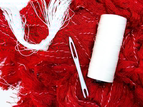 The process of knitting a fishing net. Textiles and sewing materials photo