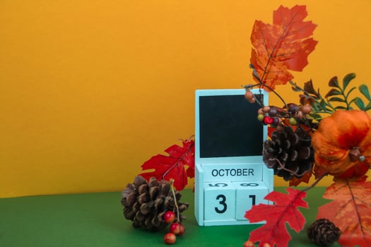Pine cones and leaves decorate a calendar with a date. photo