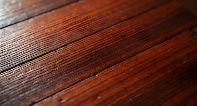 mahogany wooden surface texture, ideal for furniture catalogs, premium product mockups, and interior design visuals photo