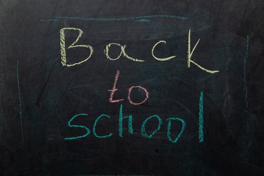 Creative Chalkboard Message Signaling the Return to School for Students and Teachers Alike photo