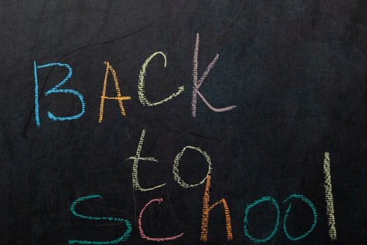 Colorful Chalk Letters Announce Back to School Season on a Chalkboard photo