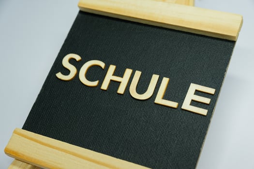 Stylish SCHULE Sign on Fabric Display Board for Educational Themes photo