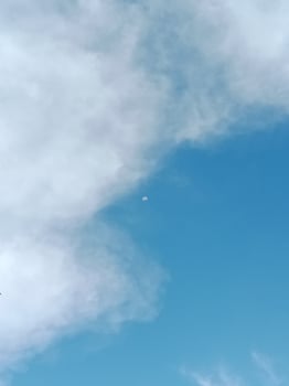 A plane flying in the sky with a cloud in the background photo