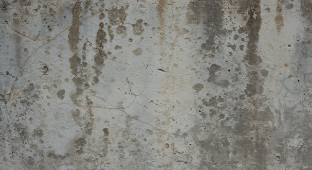 Aged Concrete Wall with Weathered Texture and Cracks for Industrial or Urban Design photo