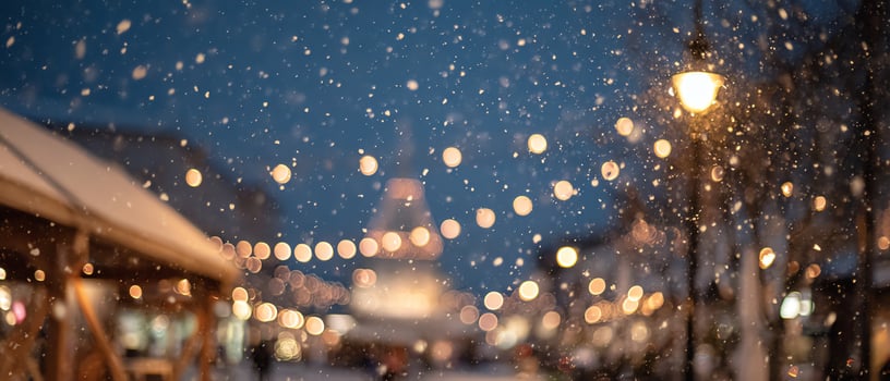 Holiday street scene with soft snowflakes falling. photo