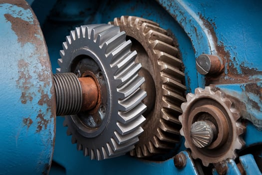 Close up of metal gears in a blue machine showcasing industrial engineering. photo