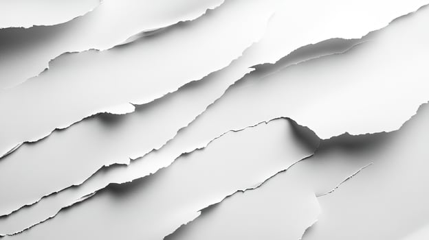 Ripped white paper layers cast subtle shadows creating an abstract and artistic composition photo