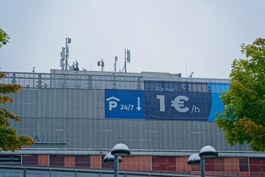 Large parking lot sign showing 24 7 parking for one euro per hour in Flensburg photo