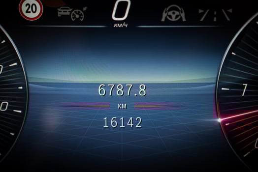 Digital car dashboard with odometer at 16142 km, trip at 6787.8 km, and speedometer at 0 km or h. Features include speed limits and cruise control. photo