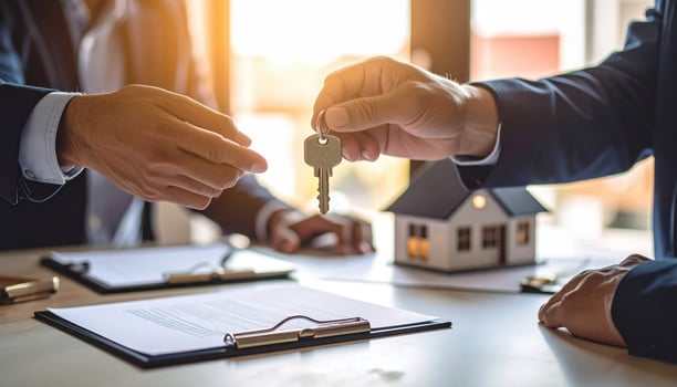 Image depicts real estate transaction, showcasing hands exchanging keys, symbolizing transfer of property ownership. scene conveys sense of accomplishment and new beginnings photo