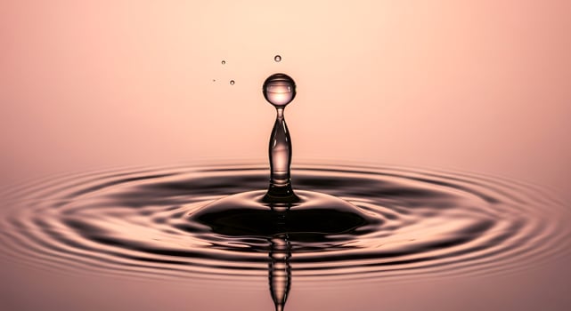 High-Speed Macro Photo of a Water Drop Splash with Ripples