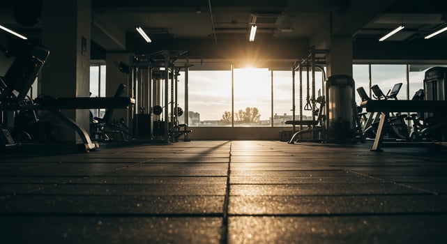 Low Angle View of an Empty Gym Bathed in Golden Sunrise Light photo