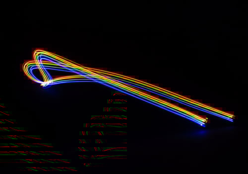 Luminous Rainbow Light Trails Form a Dynamic Heart-Shaped Loop photo