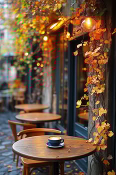 Cozy Outdoor Cafe With Autumn Leaves and Warm Lighting in a Vibrant City Street. photo