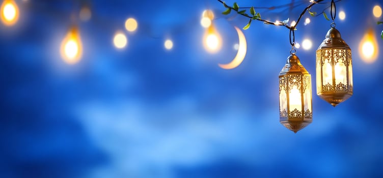 Lanterns and crescent moon against a blue background creating a festive atmosphere photo