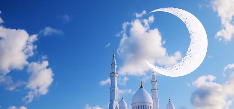 Mosque and crescent moon against blue sky architectural and religious symbolism photo