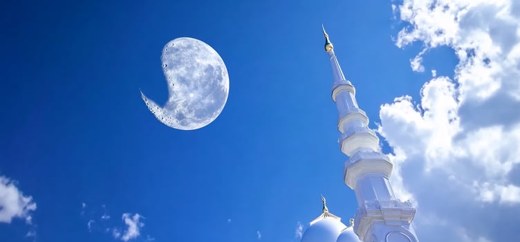 Elegant white tower under clear blue sky with moon background photo