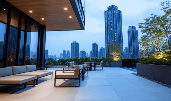 Modern outdoor lounge with cityscape view at dusk photo