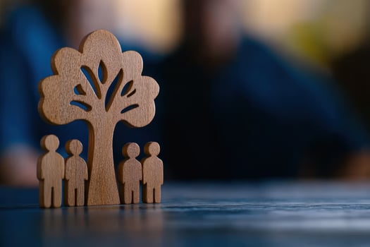 Wooden family tree model on table, blurred background photo