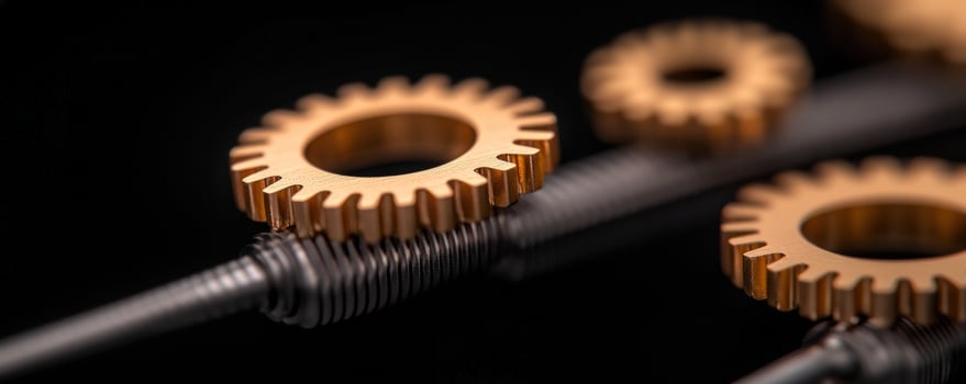 Golden gears on a screw, dark background, mechanism concept photo