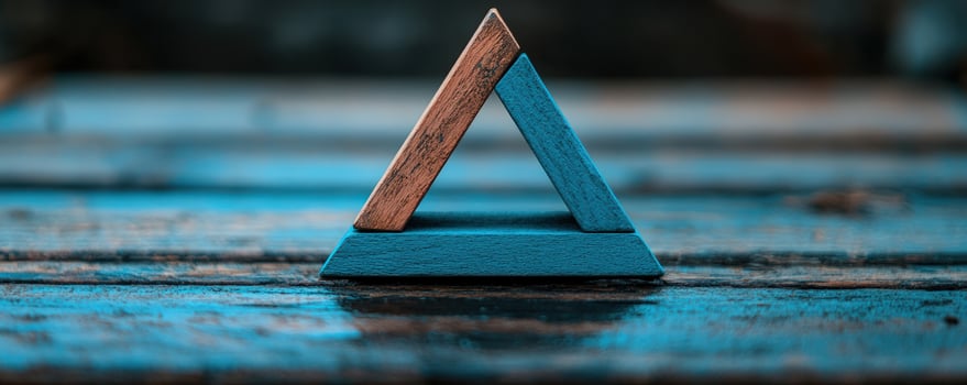 Wooden triangle puzzle on rustic wood photo