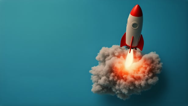 Rocket Launches Into the Sky, Leaving Behind a Trail of Smoke and Fire in the Bright Blue Background photo
