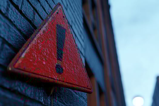 Red warning sign, urban brick wall, city background, caution photo